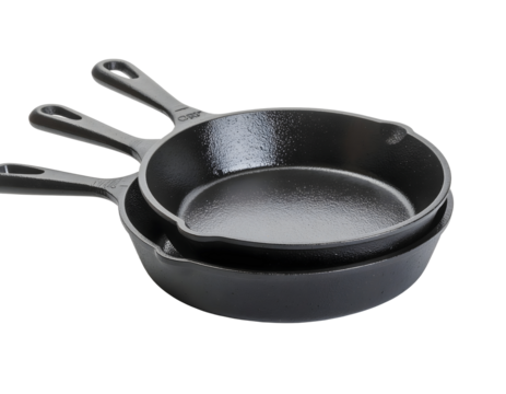Stack of two cast iron skillets in different sizes, isolated