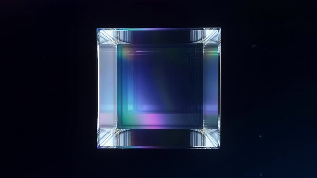 A rotating cube of glass floats in space, refracting shifting colors through its faces. The camera approaches slowly, passing through the cube into a world of mirrored reflections.