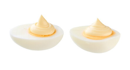 Half a boiled chicken egg with mayonnaise isolated on a white background.