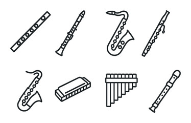 Various musical wind instruments on dark background