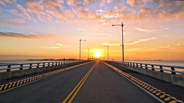 View through the windshield of a car driving over the Kinmen Bridge  in Taiwan at sunset