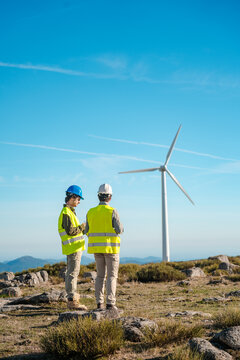 Engineers Inspecting Wind Turbine on a Sunny Day &ndash; Spain