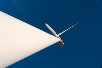 Minimalist View of Wind Turbine Against Deep Blue Sky – Spain