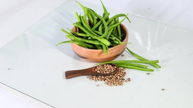 cluster beans or gawar phali(guar) and seed on the white background,cyamopsis tetragonoloba
