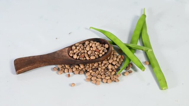 cluster beans or gawar phali(guar) and seed on the white background,cyamopsis tetragonoloba