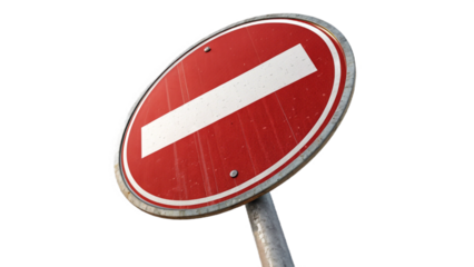 A close up of a red and white no entry sign against a dark background on a metal pole outdoors