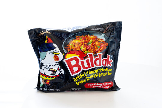 Calgary, Alberta, Canada. Oct 25, 2025. Black Samyang Buldak instant ramen package featuring the spicy chicken flavour, the popular hot Korean noodle dish, isolated on white.