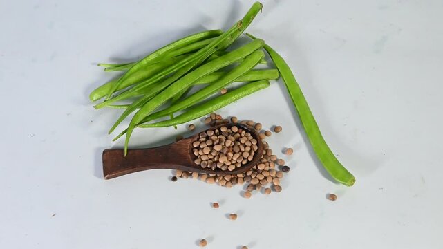 cluster beans or gawar phali(guar) and seed on the white background,cyamopsis tetragonoloba
