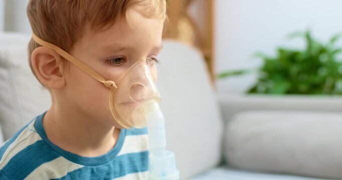 Child Using Nebulizer for Breathing Treatment at Home