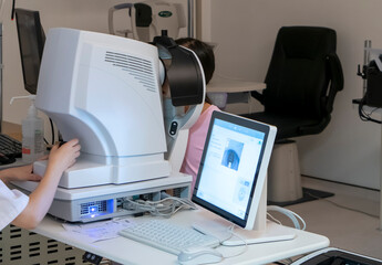 The little girl has her vision checked in the hospital