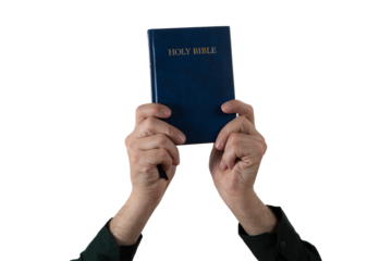 Hands holding Holy Bible book. Sacred scripture. Isolated background