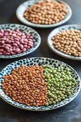 Obraz premium Brown Lentils Green Soybeans Red Kidney Beans in Bowls