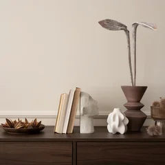 Fototapete Wohnzimmer Interior design of aesthetic living room interior with copy space, wooden sideboard, vase with dried flowers, books, modern sculpture, beige wall with stucco and personal accessories.   © FollowTheFlow