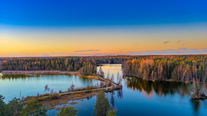 Golden Reflections of Autumn on a Finnish Lake