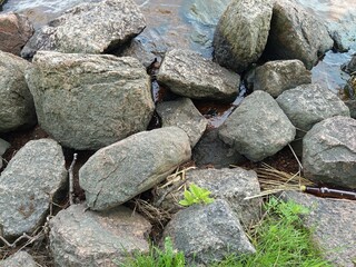 the collapsed masonry of the Swedish fortress lies on the riverbank
