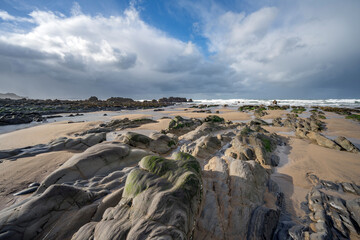 Ancient rock formations on Cornwalls Sandymouth Bay beach