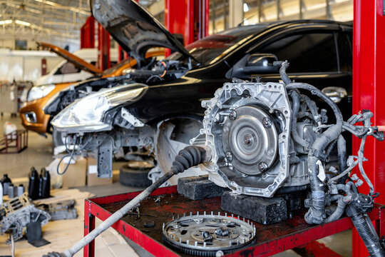 Automatic transmission system disassembled on a workbench in a professional auto repair garage. focus on car service and vehicle maintenance.