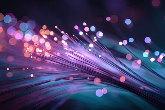 Close up of glowing fiber optic strands with bokeh background