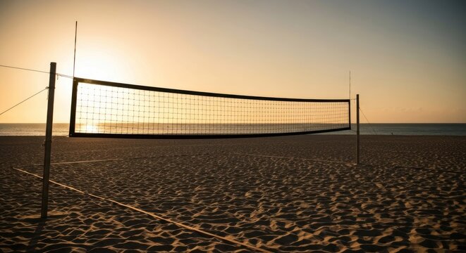 Beach volleyball net silhouetted against a warm, golden sunset on sandy shore - Powered by Adobe