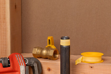 Installing natural gas or propane black iron pipe. Plumbing, home maintenance, natural gas safety and repair concept.