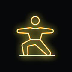 Yellow neon sign depicting a person performing a yoga warrior pose on a black background
