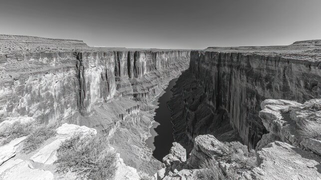 Canyon walls tower over a serene river winding through the valley