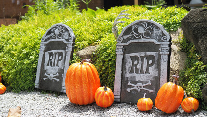 Halloween decorative tombstones with RIP inscription. Halloween Pumpkins.