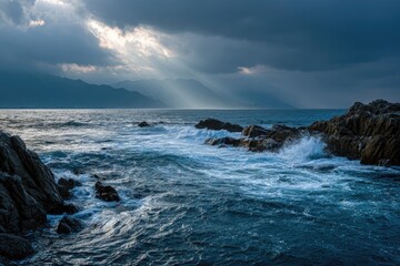 Dramatic Seascape Light rays pierce through stormy clouds over crashing waves and rocky coastline