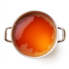 Delicious Brew of Orange Tea in Stainless Steel Pot with Foam on Surface Displaying Rich Color and Texture