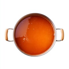 Aerial View of a Stainless Steel Pot Filled with Rich Orange Broth on a White Background