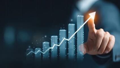 Hand pointing to rising stock market graph with glowing arrow