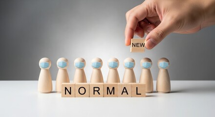 Hand placing new wooden block on normal word isolated on white background