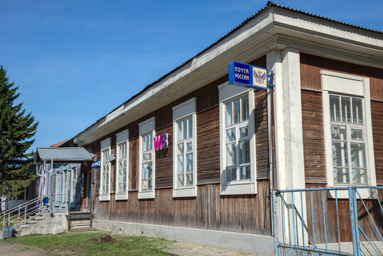KOLYVAN, RUSSIA - AUGUST 28, 2025: The old wooden building of the Russian Post Office. Kolyvan, Novosibirsk region