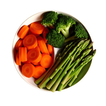 Fresh broccoli carrots and asparagus arranged on a white plate isolated on transparent background