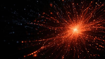 Obraz premium A dense cluster of bright orange particles emitting radiant light against a dark background resembling a technological explosion