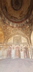 Intricately Carved Stucco Ceiling and Arches of Bada Gumbad Mosque in Delhi Showcasing Islamic Geometric Patterns and Calligraphic Art