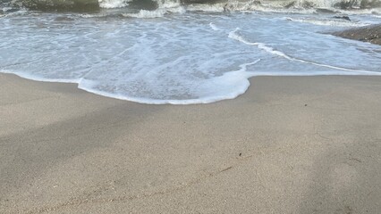 Sea Wave Crashing on Sandy Beach