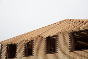 Roof construction for a house. Making a wooden formwork for the roof.