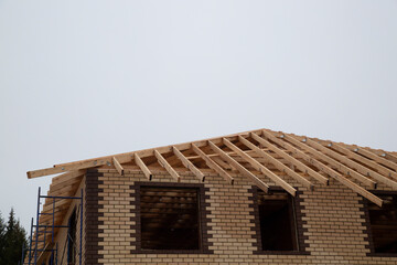 Roof construction for a house. Making a wooden formwork for the roof.