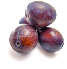 Juicy Stone Fruits: Halved and Whole Plums for Culinary Use