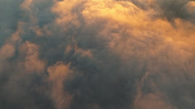 Experience the beauty of a serene sunset with soft clouds
