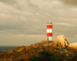 Beautiful natural picture with nice sky and blue ocean, beautiful bay and lighthouse, nice rock, blue sea with mountain on horizontal