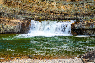 Scenic View of Emerald Kootenay River Through Forest Mountains