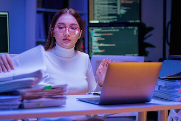 Asian female smart programmer works late night office coding deep learning AI models, training neural networks with intense concentration and focus, dedicating overtime hours alone to machine learning