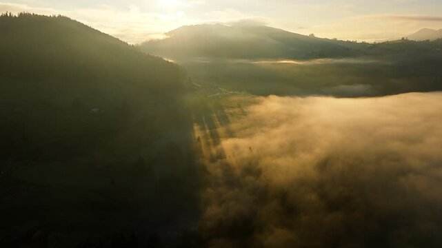 A Serene Sunrise Unfolds Over a Misty Valley Landscape, Majestic and Calm
