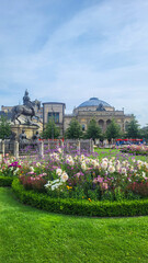 07 August, 2024, Copenhagen city center, Denmark Summer day scenic canal with boats and tourists, cyclists riding along colorful buildings and waterfront, vibrant urban atmosphere in European capital