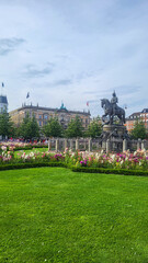 07 August, 2024, Copenhagen city center, Denmark Summer day scenic canal with boats and tourists, cyclists riding along colorful buildings and waterfront, vibrant urban atmosphere in European capital