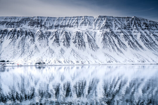 Snowy Mountain Reflected in Calm Water