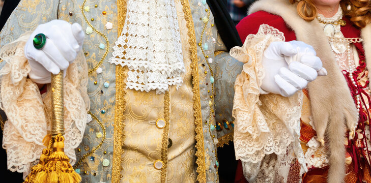 People wearing elegant historical costumes at Venice carnival
