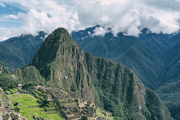 The iconic view with the Inca citadel Machu Picchu in the Andes Mountains of Peru